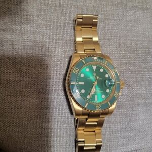 Rolex Gold and Green Watch